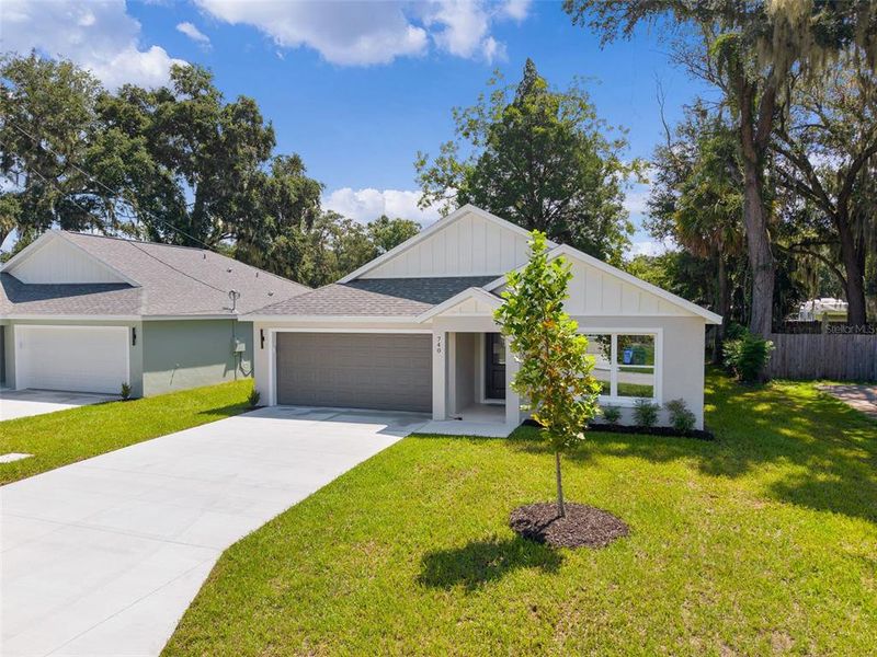 Front exterior of a new home in , Wildwood, FL, highlighting curb appeal (Image 22).