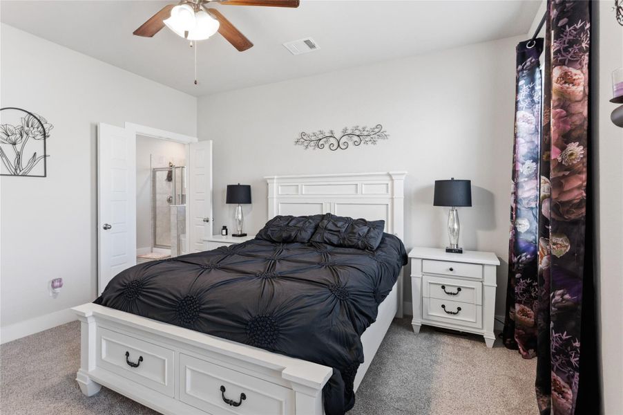 Spacious primary bedroom plush carpeting, and an ensuite bathroom for ultimate comfort. Spacious primary bedroom plush carpeting, and an ensuite bathroom for ultimate comfort.