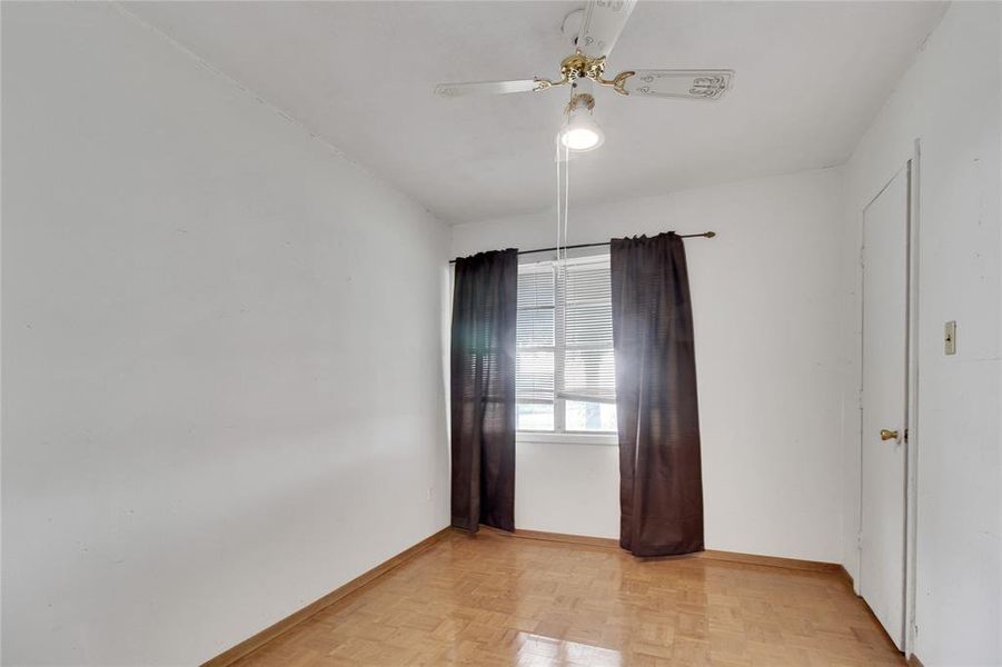 Empty room with baseboards and ceiling fan Empty room with baseboards and ceiling fan