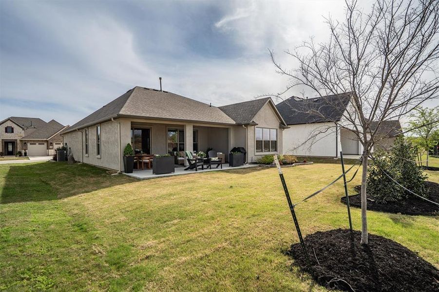 Exterior details and patio area of a home in Robson Ranch Texas, Denton (Image 27).