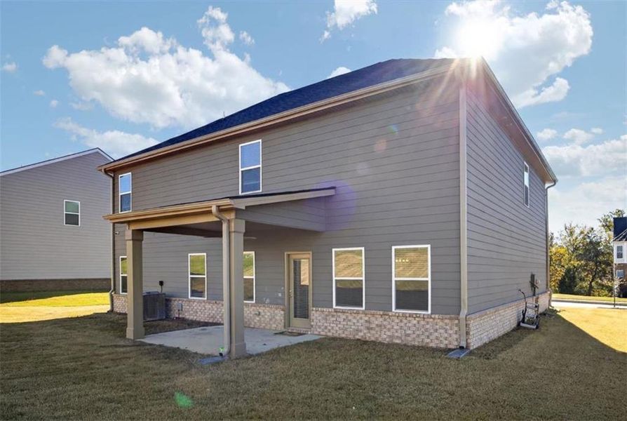Exterior details and patio area of a home in The Enclave at Dial Farm Phase III, Walnut Grove (Image 4).