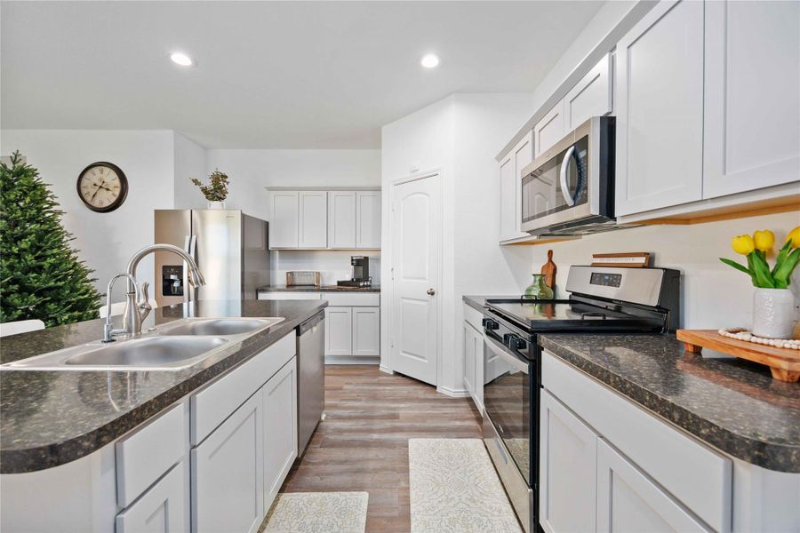 Kitchen – Prep & Appliance ViewEfficiently designed kitchen offering ample counter space for meal prep, stainless steel appliances, and abundant cabinetry for storage. The well-planned layout provides excellent workflow between sink, range, and refrigerator, making the space both practical and inviting for everyday use and entertaining. Kitchen – Prep & Appliance ViewEfficiently designed kitchen offering ample counter space for meal prep, stainless steel appliances, and abundant cabinetry for storage. The well-planned layout provides excellent workflow between sink, range, and refrigerator, making the space both practical and inviting for everyday use and entertaining.