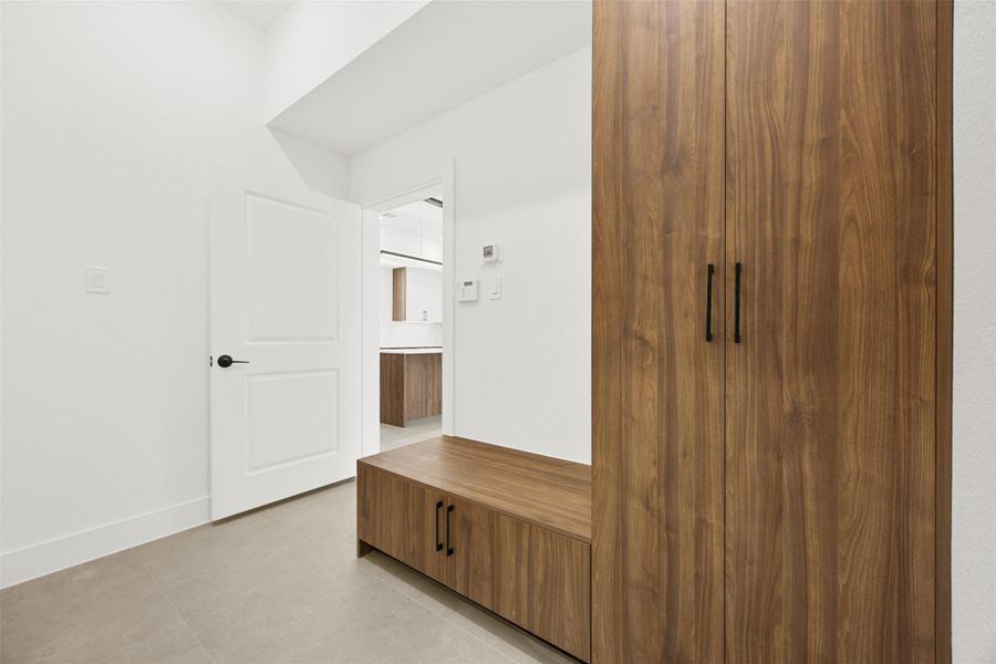 Built-in mudroom bench and storage lockers create the perfect everyday organization space.