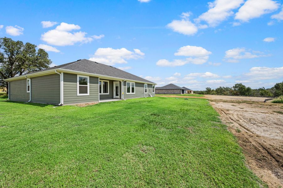 Exterior details and patio area of a home in Gatlin Ranch, Springtown (Image 19).