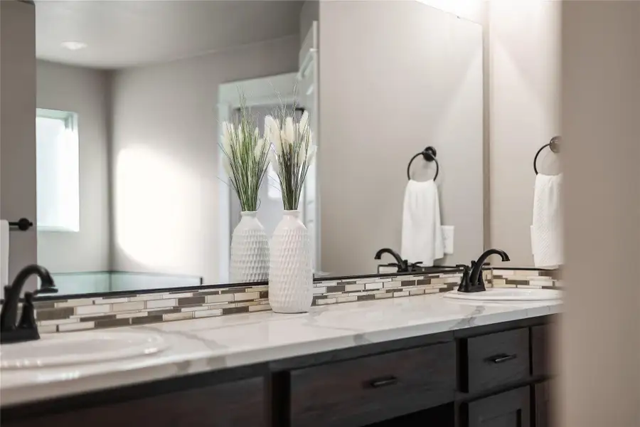 Beautiful accent tile at the sinks- also located around the soaking tub
