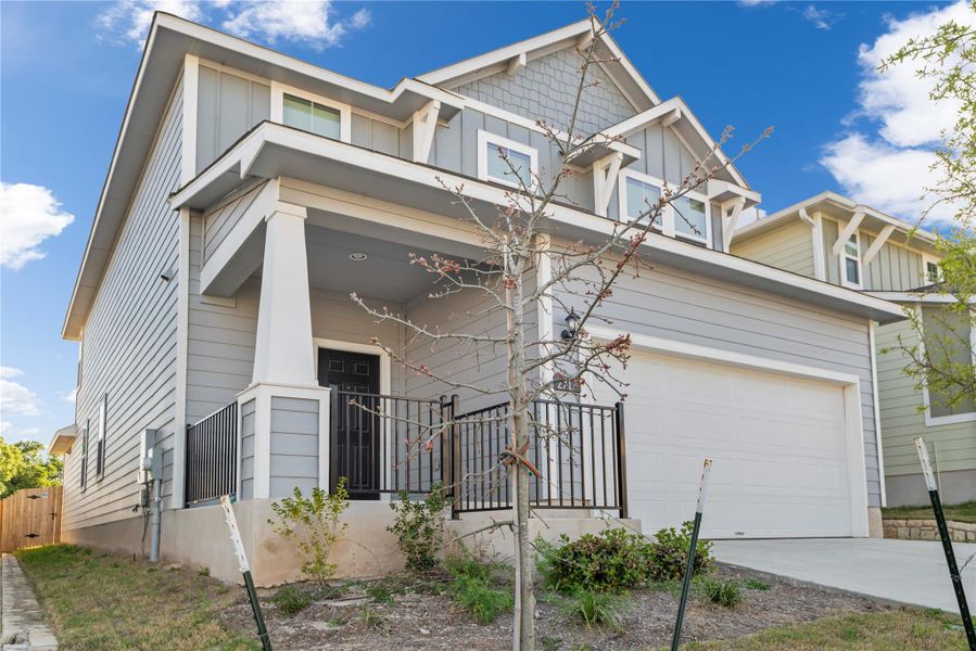 Front exterior of a new home in Edgebrooke, Pflugerville, TX, highlighting curb appeal (Image 26). Front exterior of a new home in Edgebrooke, Pflugerville, TX, highlighting curb appeal (Image 26).