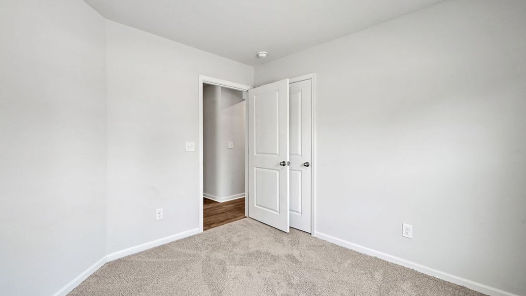 Representative unfurnished interior of a home built from the BAYSHORE by D.R. Horton in Indigo Preserve Townhomes, Leland (Image 28).