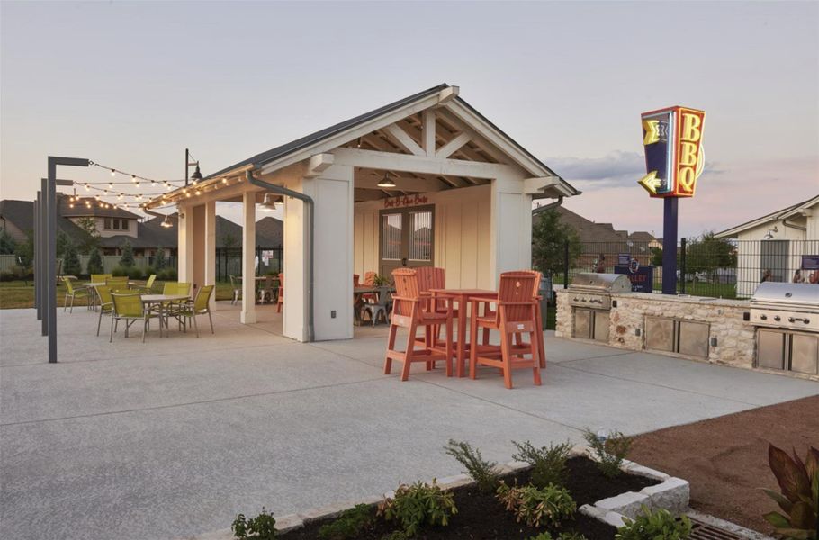 View of patio featuring area for grilling, an outdoor structure, and outdoor dining space
