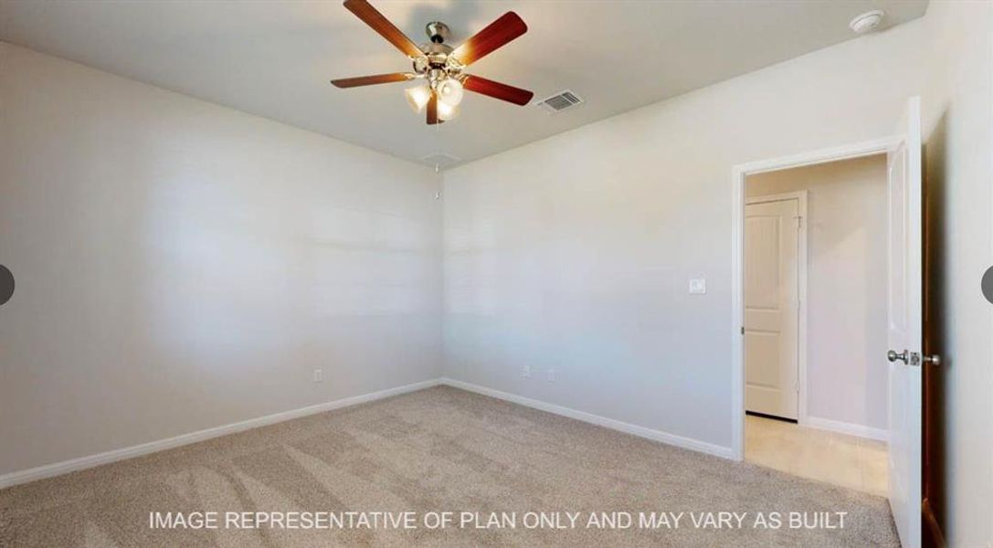 Empty room with baseboards, carpet flooring, ceiling fan, and visible vents Empty room with baseboards, carpet flooring, ceiling fan, and visible vents