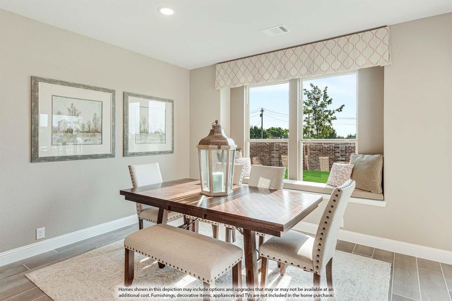 Dining area with wood table, bench seating, window seat, and large window overlooking backyard