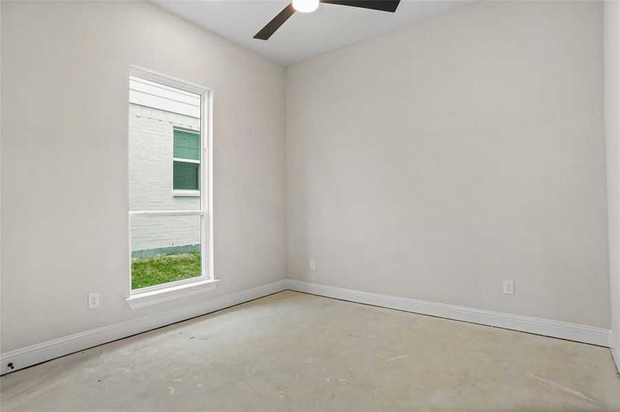 Unfurnished room featuring ceiling fan