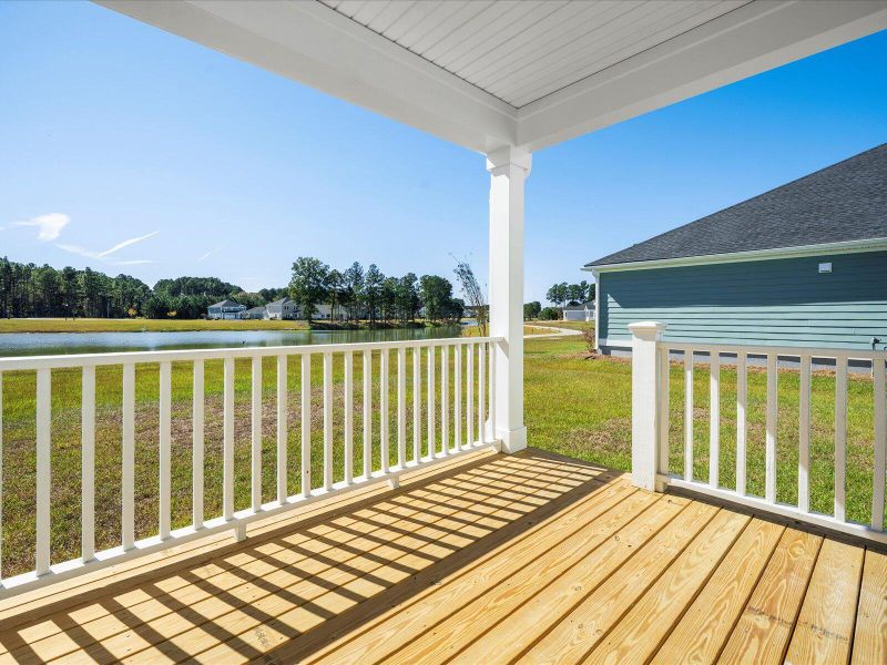 Exterior details and patio area of a home in The Coves at Lakes of Cane Bay II, Summerville (Image 26).