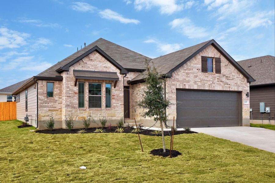 Front exterior of a new home in Prairie Winds, Hutto, TX, highlighting curb appeal (Image 19).