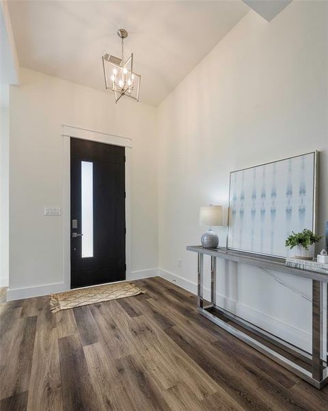 Grand entrance with soaring vaulted ceiling makes an unforgettable first impression.