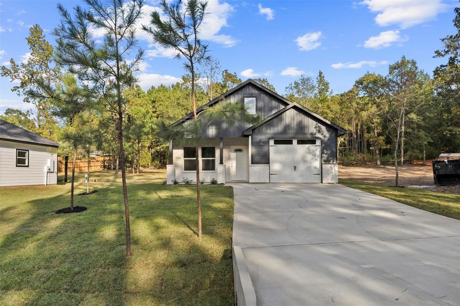 Front exterior of a new home in , Willis, TX, highlighting curb appeal (Image 12). Front exterior of a new home in , Willis, TX, highlighting curb appeal (Image 12).