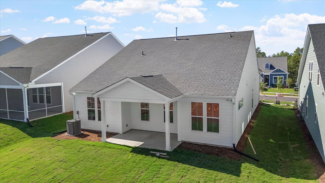 Exterior details and patio area of a home in Ovation at Sweetbrier, Durham (Image 21).