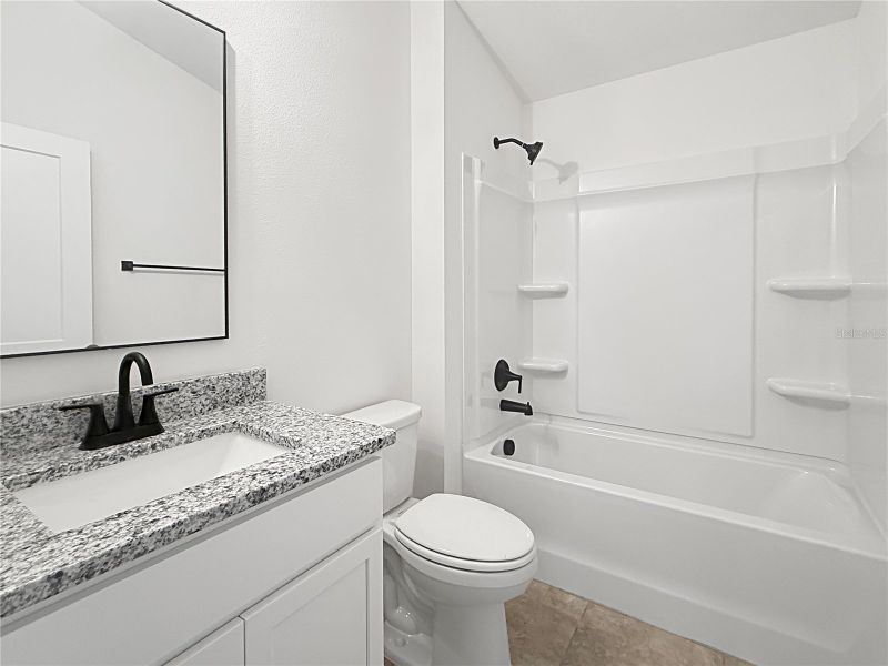 Furnished interior view inside a new home in Harmony Central, St. Cloud (Image 7).