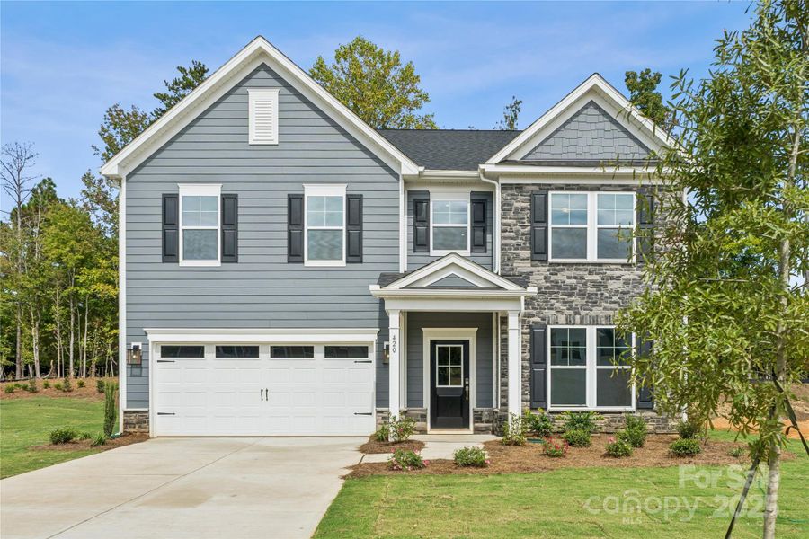 Front exterior of a new home in Glenhurst, Matthews, NC, highlighting curb appeal (Image 2).