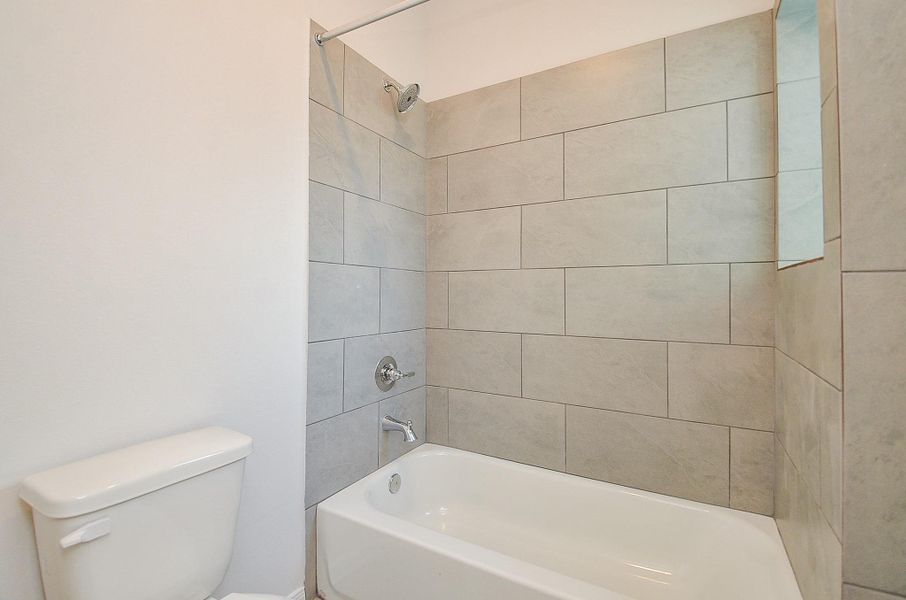 Shower/tub combination with stainless steel appliances. Shower/tub combination with stainless steel appliances.