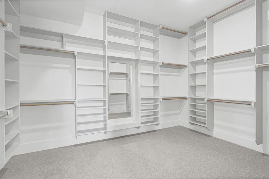 Walk in closet with light colored carpet Walk in closet with light colored carpet