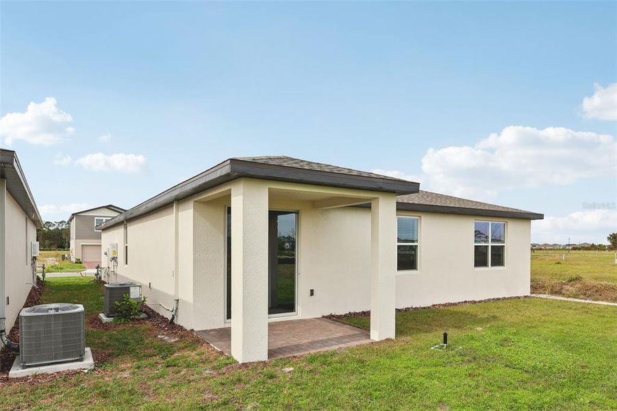 Exterior details and patio area of a home in The Reserve at Twin Lakes, St. Cloud (Image 4).
