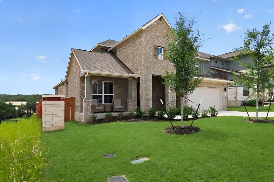Brick veneer exterior with a covered front porch, an attached garage, a driveway, and a fenced side yard Brick veneer exterior with a covered front porch, an attached garage, a driveway, and a fenced side yard