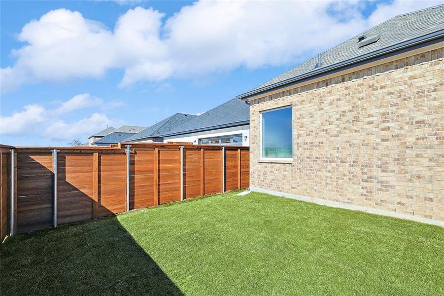 View of fenced backyard