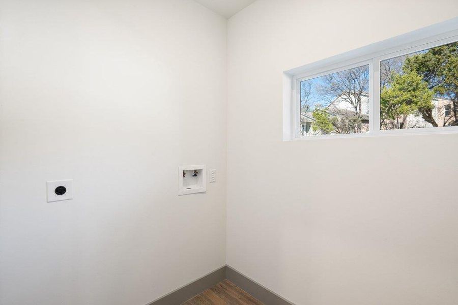 Laundry area featuring dark wood finished floors, electric dryer hookup, and hookup for a washing machine