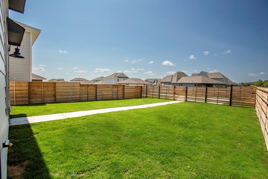 Exterior details and patio area of a home in Plum Creek North: Stonehill Collection, Kyle (Image 19).
