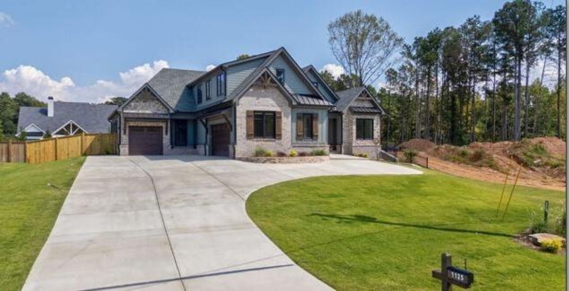 Front exterior of a new home in , Cumming, GA, highlighting curb appeal (Image 35).