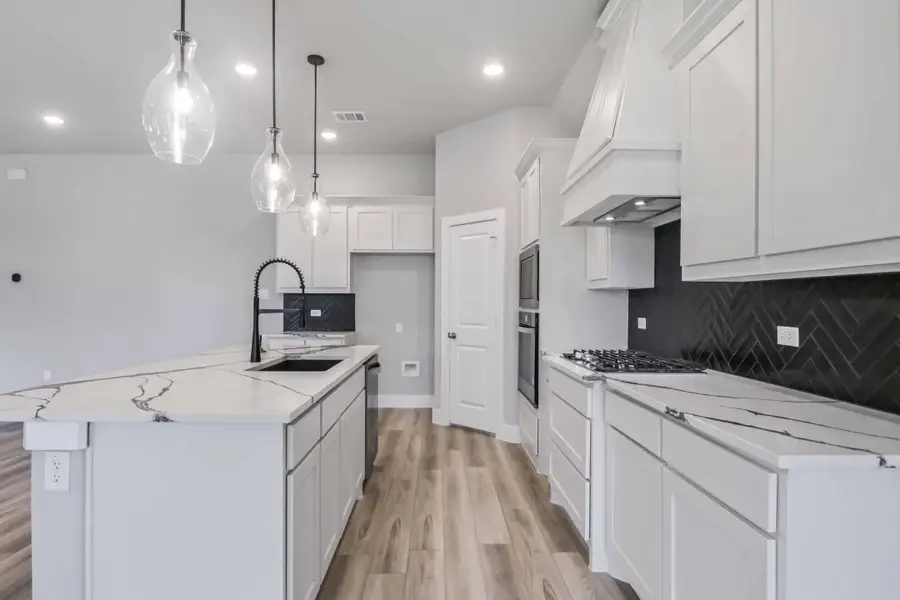 Representative furnished interior of a home built from the The Teton by Lillian Custom Homes in Polo Ridge, Heath (Image 5).