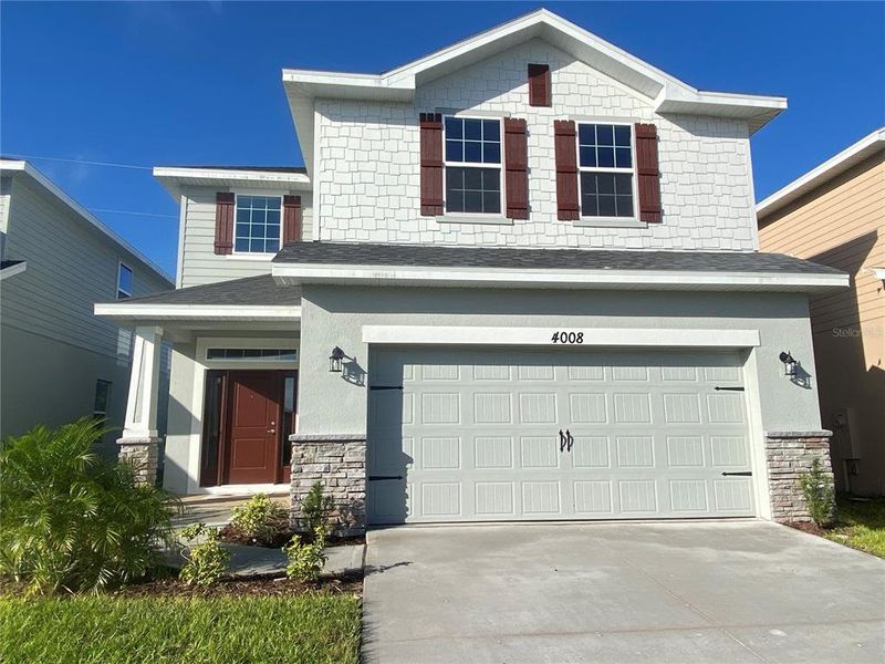 Front exterior of a new home in Harmony Central, Harmony, FL, highlighting curb appeal (Image 2). Front exterior of a new home in Harmony Central, Harmony, FL, highlighting curb appeal (Image 2).