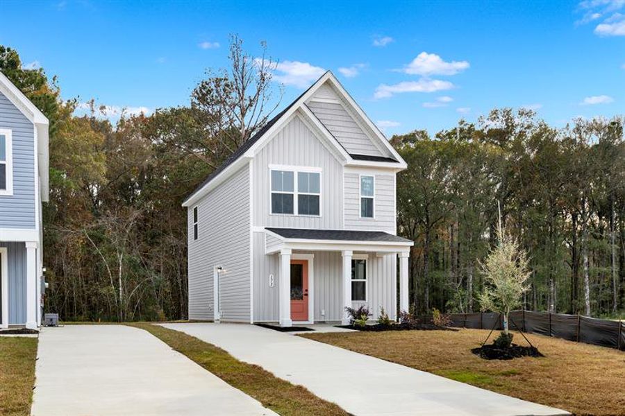 Front exterior of a new home in Royal Oaks Cottages, Hardeeville, SC, highlighting curb appeal (Image 2). Front exterior of a new home in Royal Oaks Cottages, Hardeeville, SC, highlighting curb appeal (Image 2).
