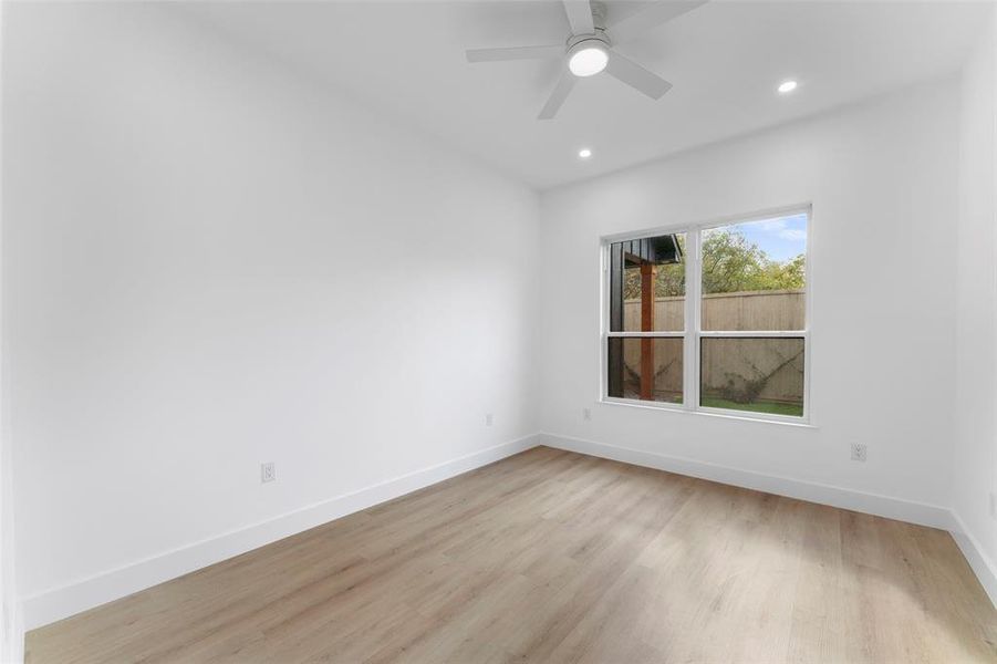 Empty room with light wood finished floors, recessed lighting, and ceiling fan