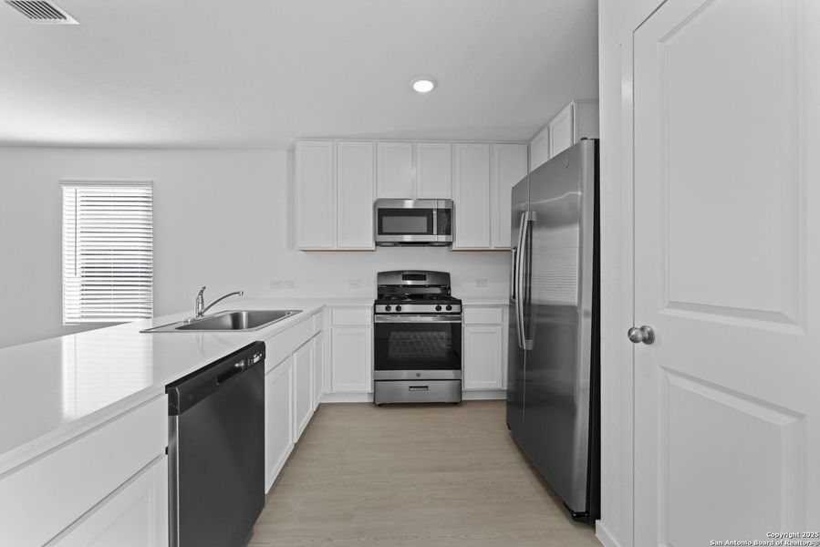 Furnished interior view inside a new home in Torian Village: Belmar Collection, San Antonio (Image 4).