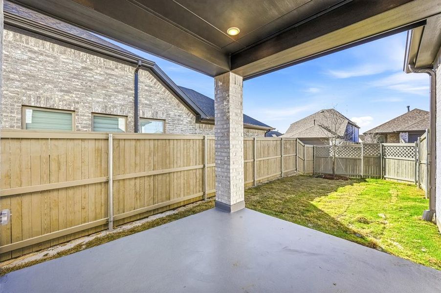 Exterior details and patio area of a home in Pecan Square, Northlake (Image 3).