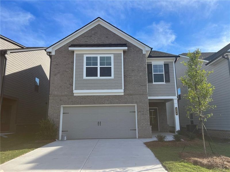 Front exterior of a new home in Crofton Place Enclave, Snellville, GA, highlighting curb appeal (Image 1).