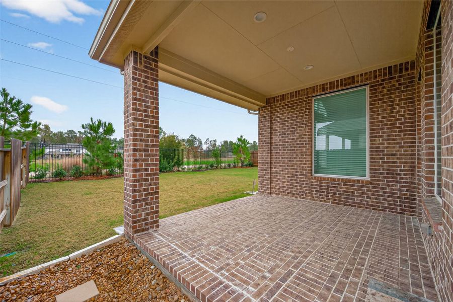 Exterior details and patio area of a home in Artavia, Conroe (Image 29).