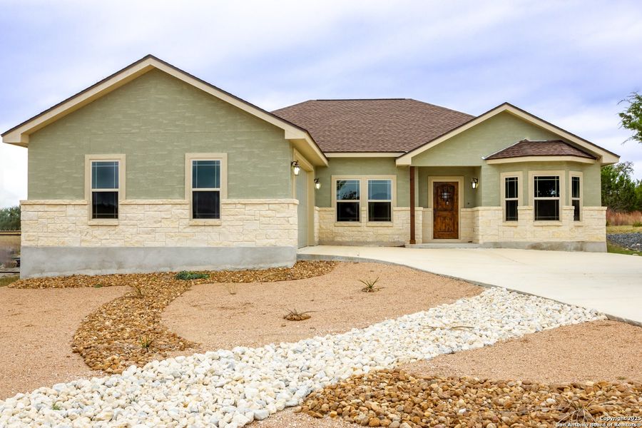 Front exterior of a new home in , Blanco, TX, highlighting curb appeal (Image 1). Front exterior of a new home in , Blanco, TX, highlighting curb appeal (Image 1).