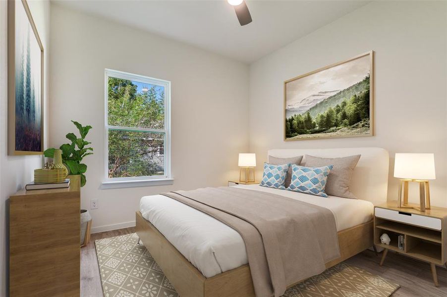 Bedroom featuring light wood-style floors and a ceiling fan