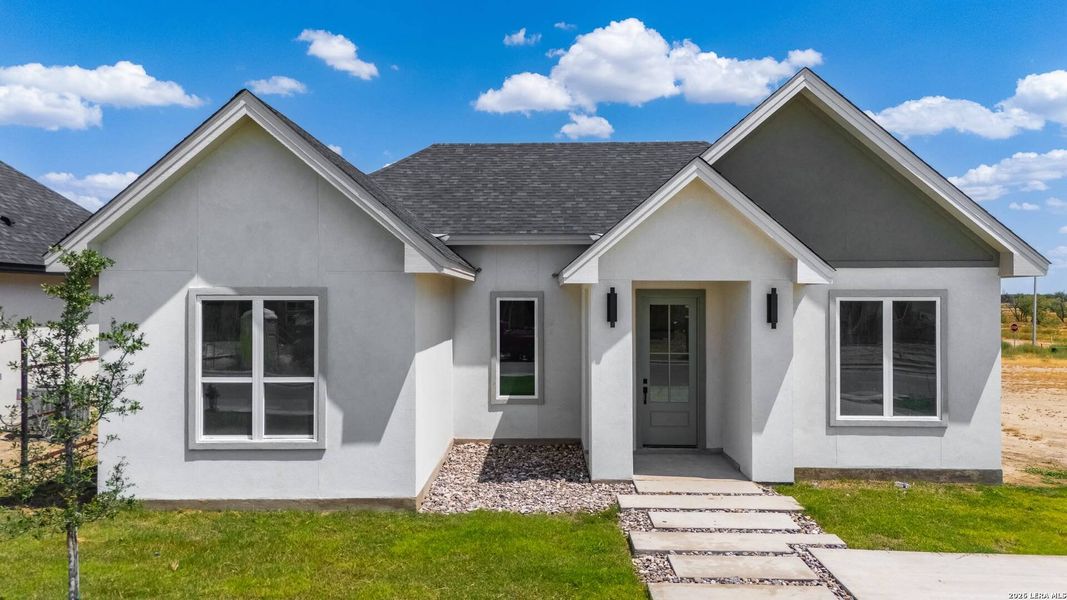Front exterior of a new home in , Eagle Pass, TX, highlighting curb appeal (Image 1). Front exterior of a new home in , Eagle Pass, TX, highlighting curb appeal (Image 1).