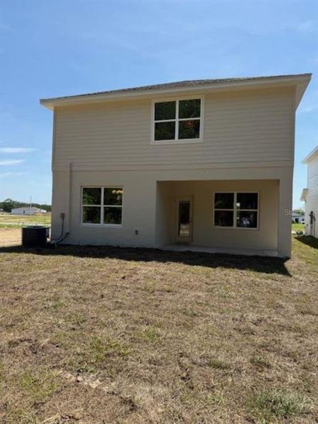 Front exterior of a new home in West Oak, Ocala, FL, highlighting curb appeal (Image 1).