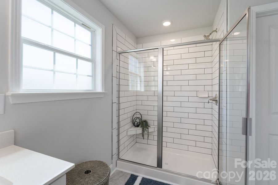 Primary bathroom with 5' tiled shower