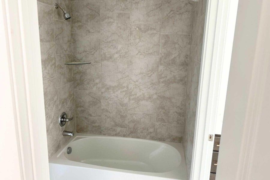 Full bathroom with bathtub / shower combination Full bathroom with bathtub / shower combination
