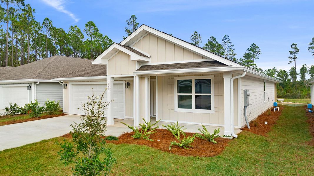Front exterior of a new home in Ashton Park Phase III, Freeport, FL, highlighting curb appeal (Image 2).