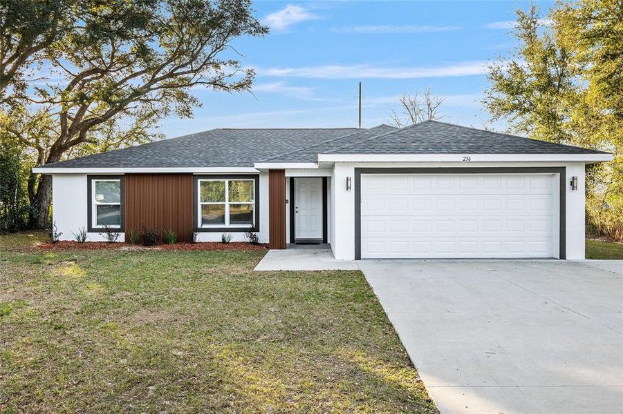 Front exterior of a new home in , Ocala, FL, highlighting curb appeal (Image 15).