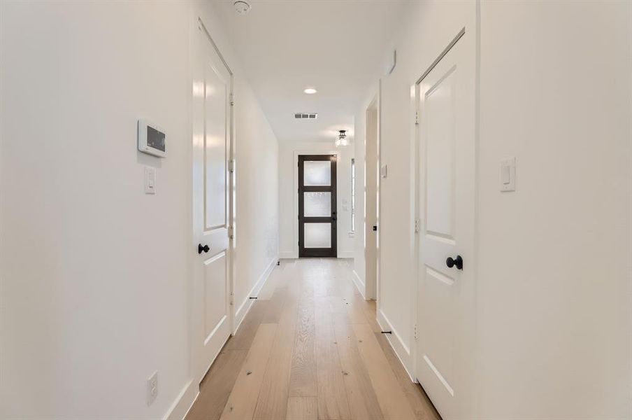 Corridor featuring light hardwood / wood-style flooring