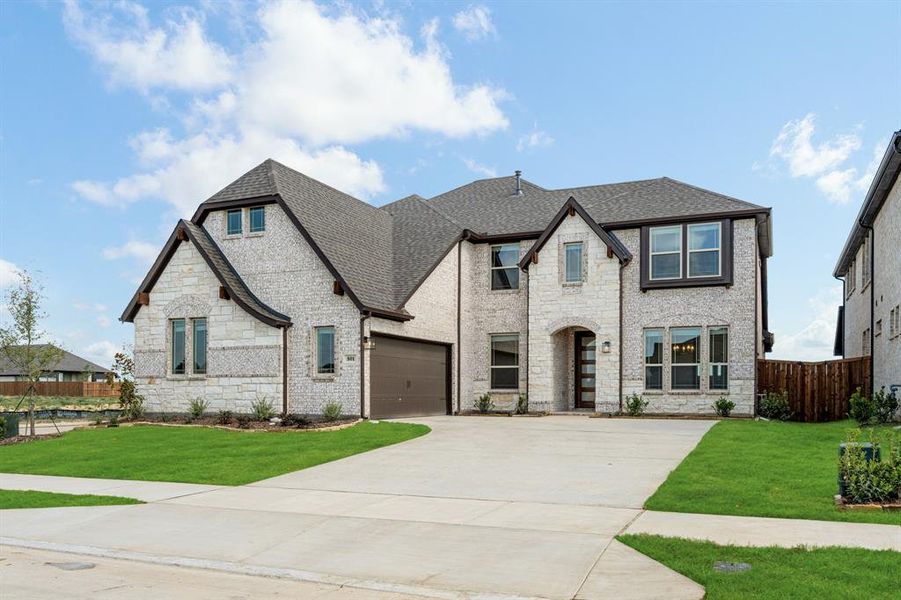 Front exterior of a new home in Wildflower Ranch 60-65, Justin, TX, highlighting curb appeal (Image 2). Front exterior of a new home in Wildflower Ranch 60-65, Justin, TX, highlighting curb appeal (Image 2).