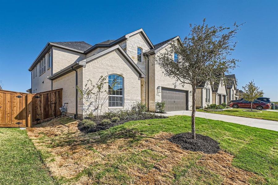 View of front of property with a front yard