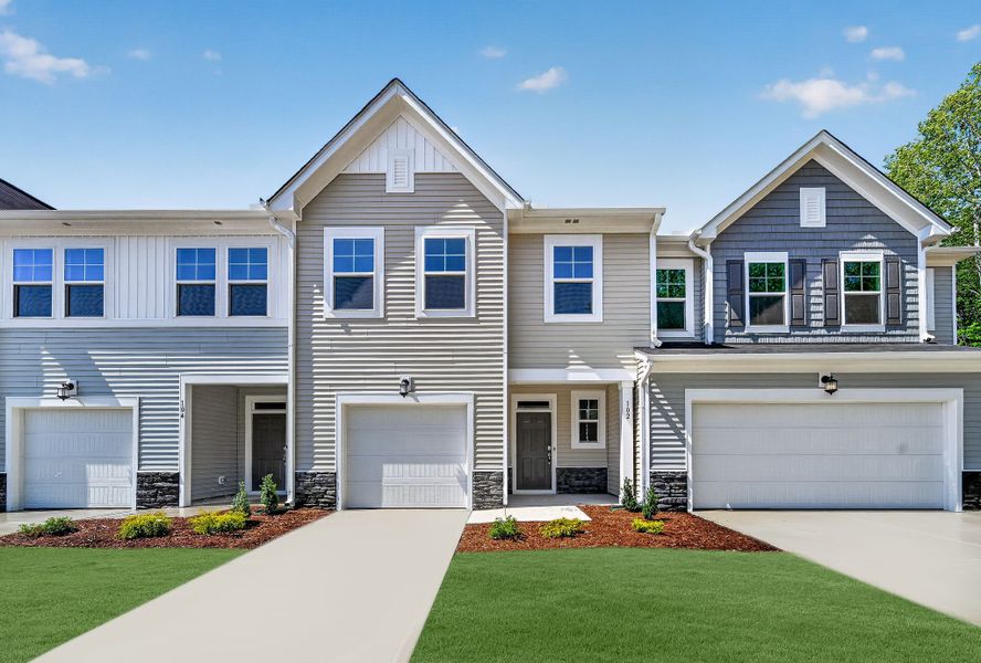 Front exterior of a new home in Parker Ridge Townes, Rolesville, NC, highlighting curb appeal (Image 1). Front exterior of a new home in Parker Ridge Townes, Rolesville, NC, highlighting curb appeal (Image 1).